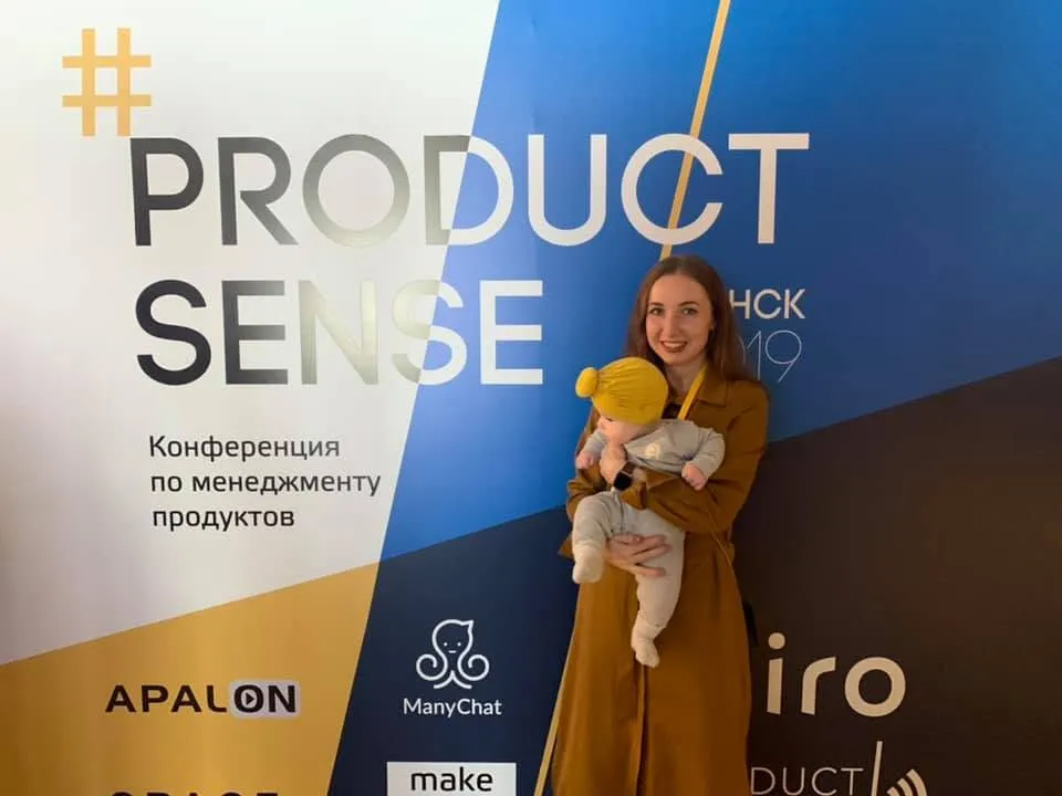 Nadia holding her baby at Product Sense Minsk 2019